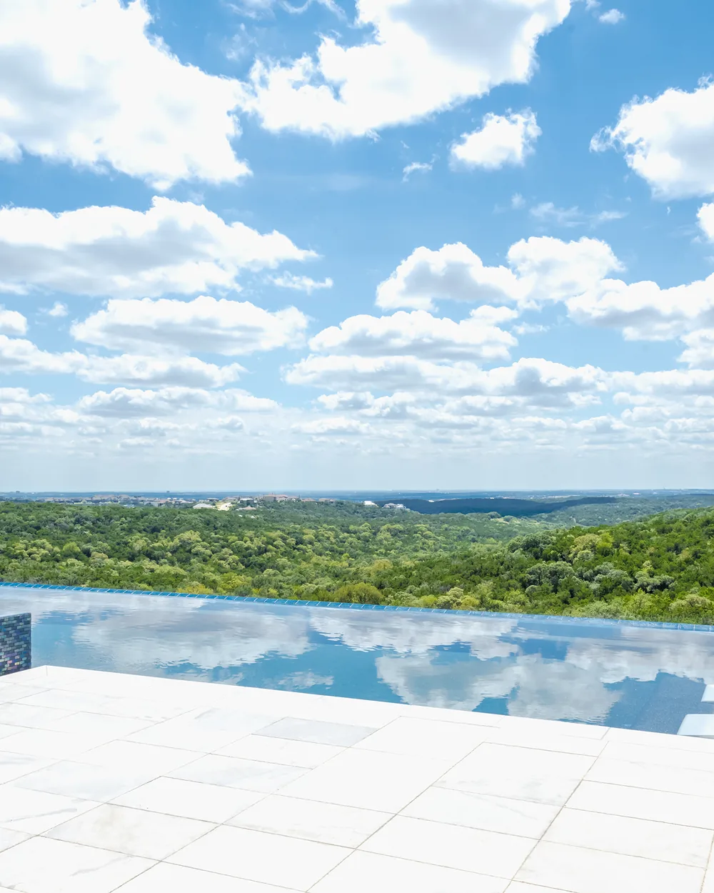 Hill Country custom home with an infinity pool and views by Dynamic Custom Homes