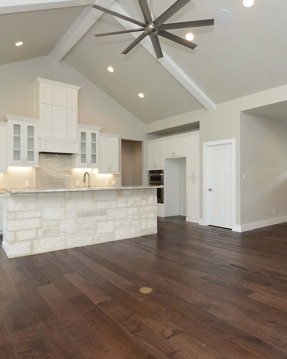 Open-concept living and kitchen in a Dynamic Custom Homes renovation